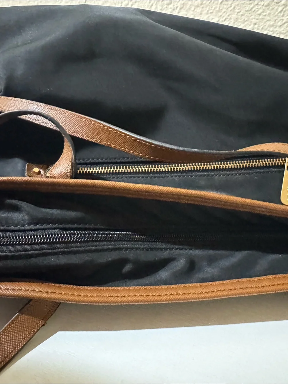 Michael Kors Black Tote with Brown Trim and Gold Plate